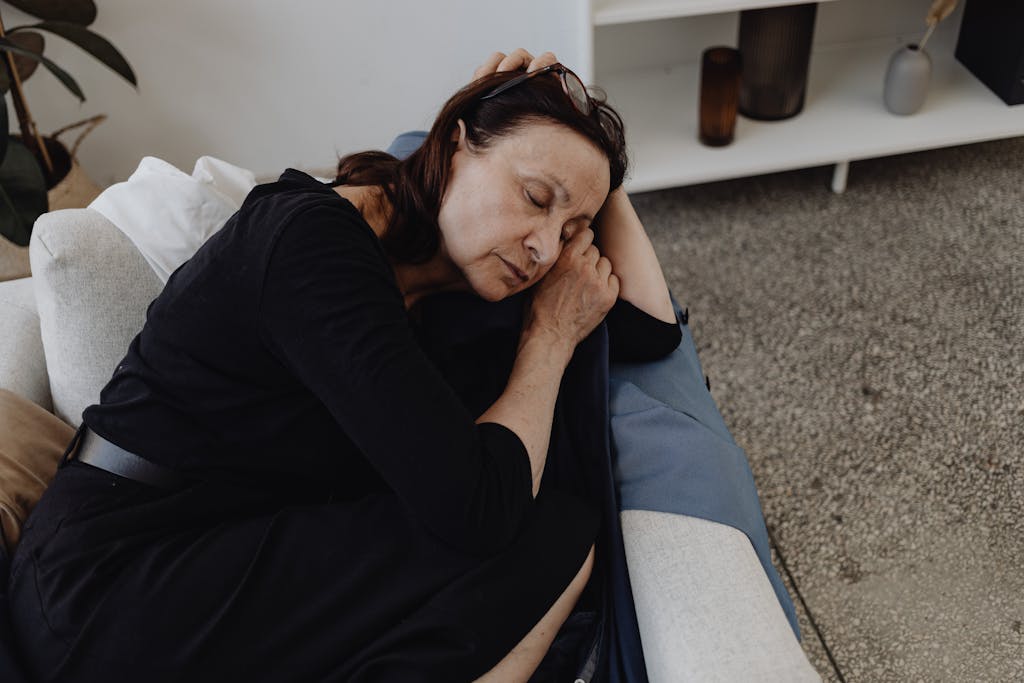 Elderly Woman Sleeping on the Sofa